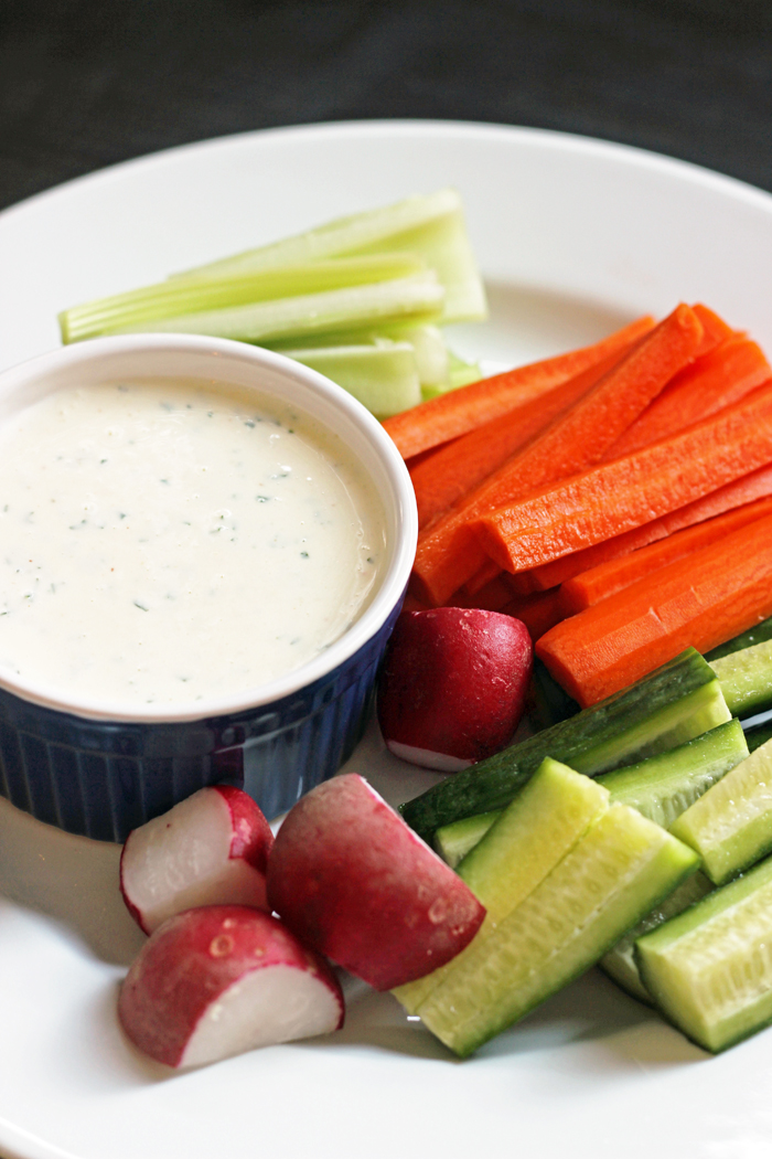 A plate of veggies with Ranch dressing