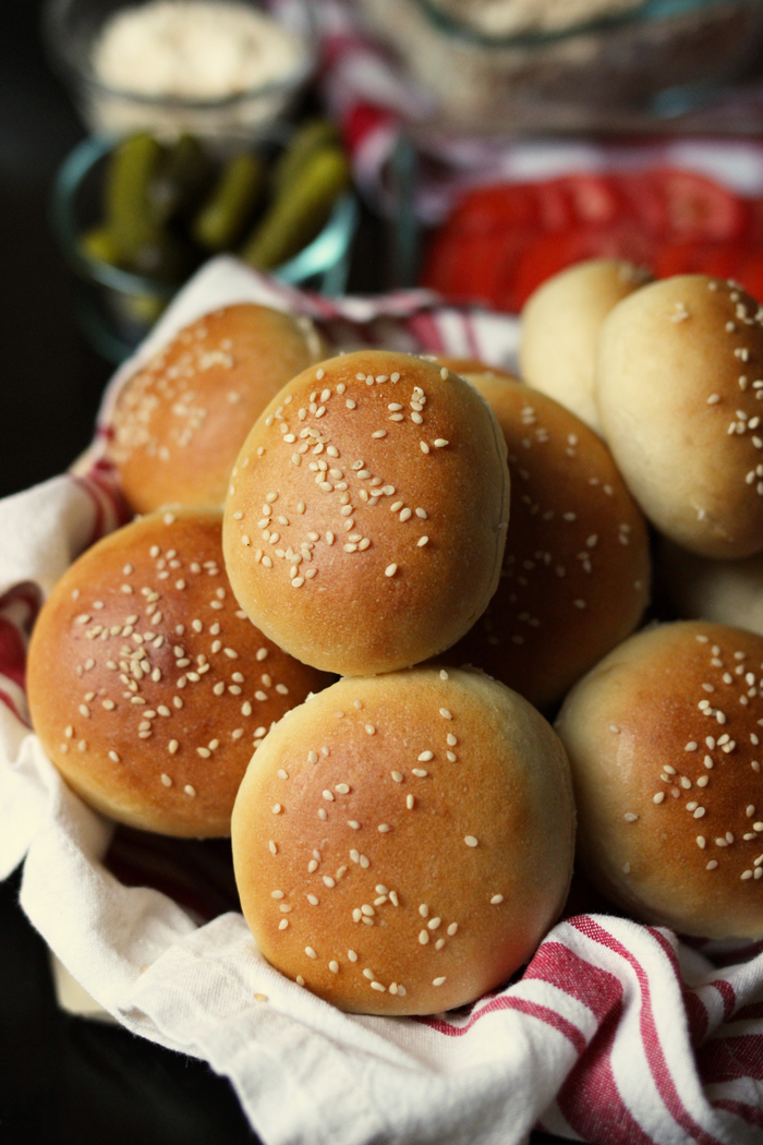 basket of hamburger buns with sesame seeds