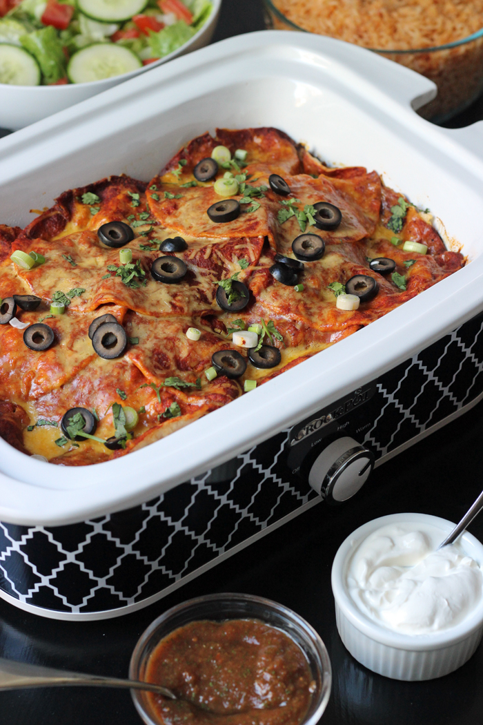 A sideview of casserole slow cooker full of enchilada 