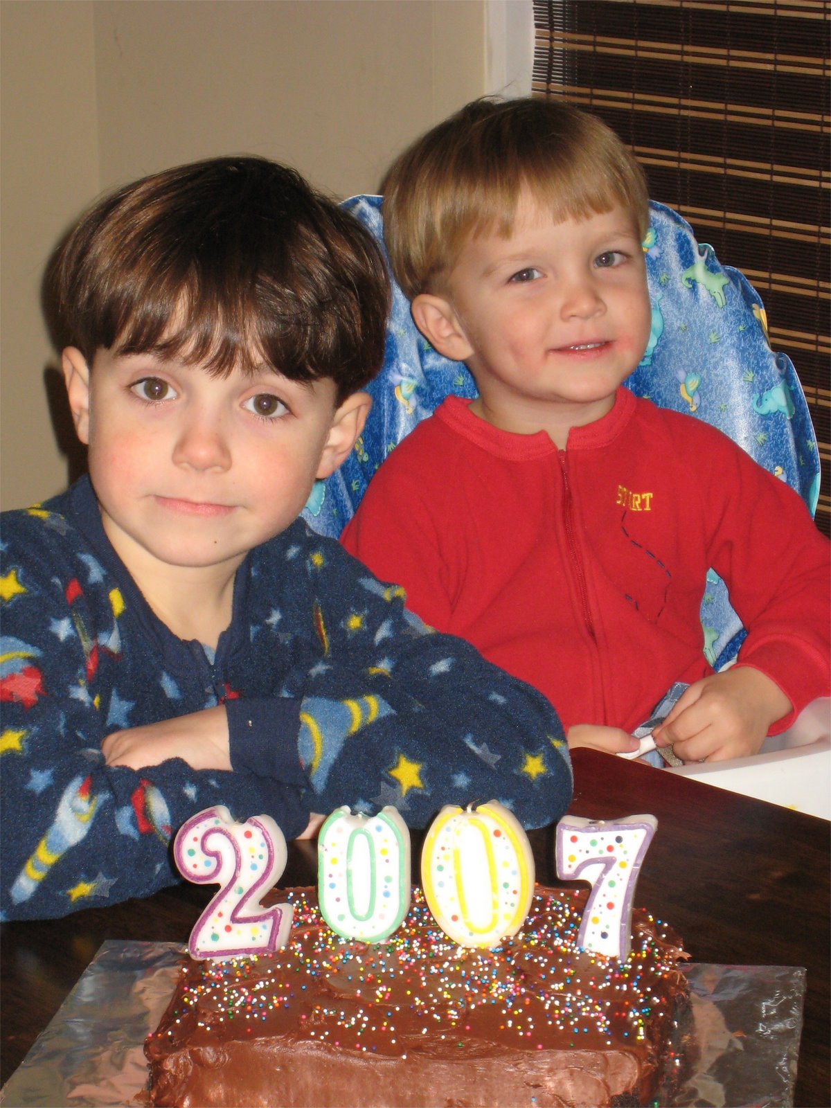 boys in pajamas with New Year's Cake