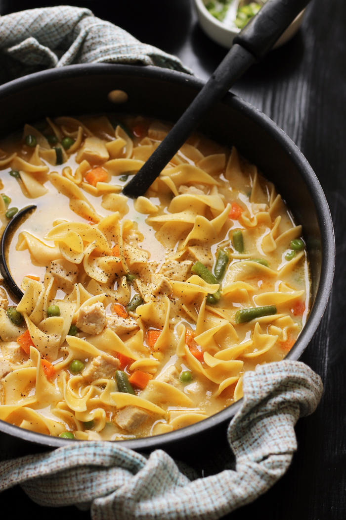 pot of creamy chicken noodle soup with vegetables