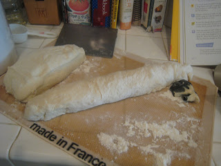 shaping baguettes on floured surface