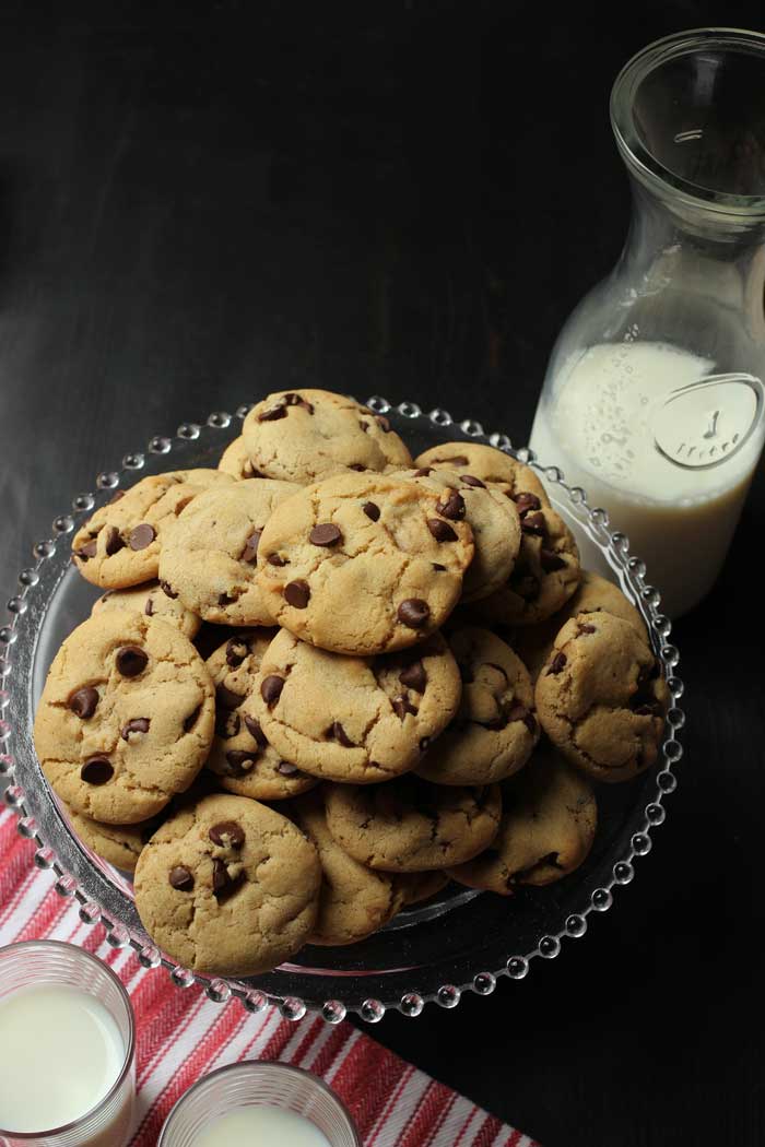 carafe and glasses of milk with tray of cookies