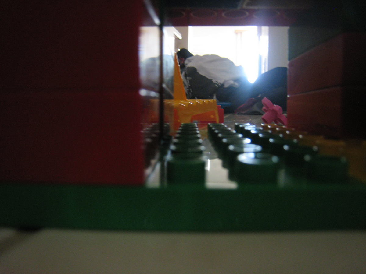 blurry photo of duplo creation next to pile of laundry