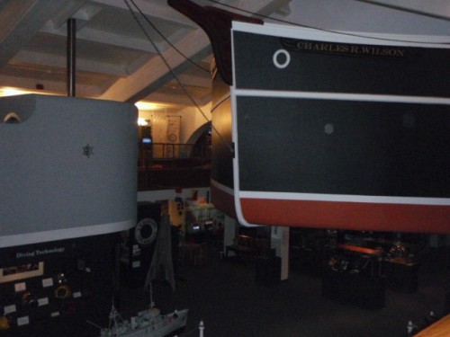 Large boats hanging from ceiling in Maritime Museum in Santa Barbara.