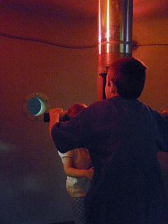 Boy looking through a periscope at Maritime Museum in Santa Barbara.