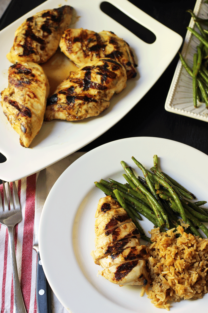 mustard grilled chicken on platter and dinner plate