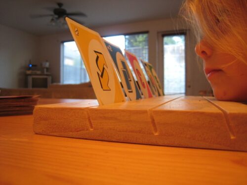 Card games are fun to play with kids. Make this card holding board so that little hands don't get frustrated.