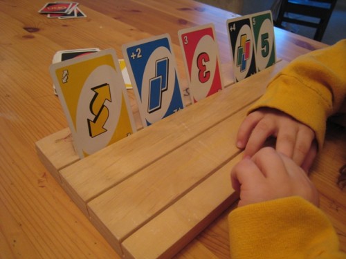 Card games are fun to play with kids. Make this card holding board so that little hands don't get frustrated.