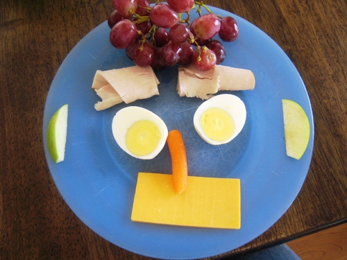 Snacky Lunch like a smiley face on a blue plate