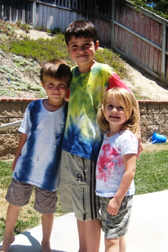 Kids wearing their new tie dye shirts.