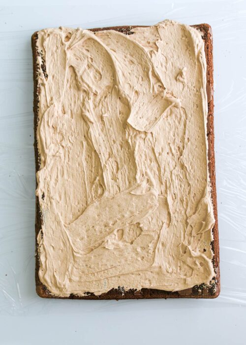 whipped cream spread on cake.