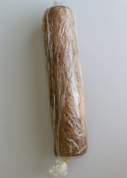 cake rolled with filling and wrapped in plastic.