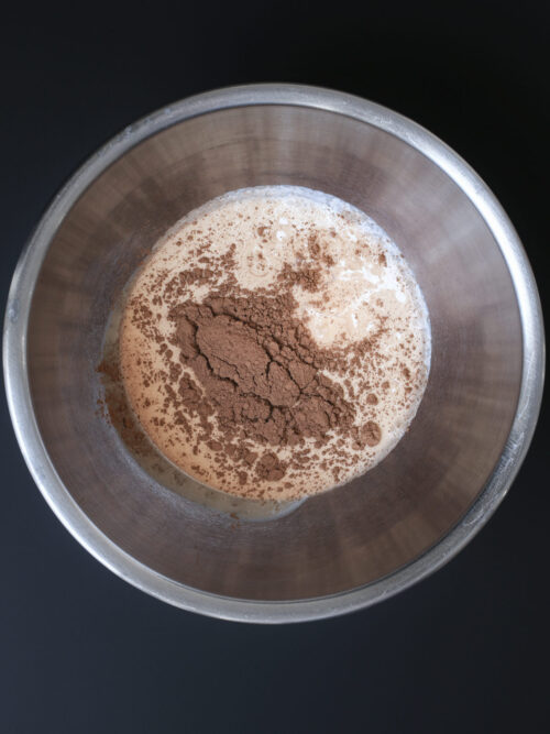 ingredients for chocolate whipped cream in mixing bowl.