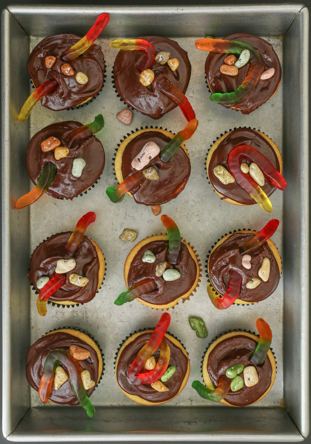 chocolate rocks added to cupcakes.
