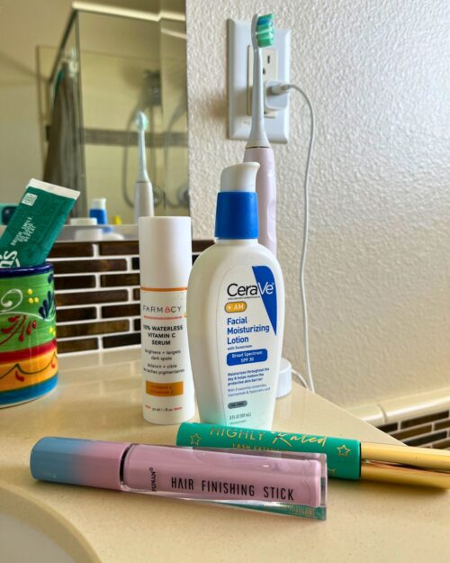 toiletries laid out on bathroom counter.