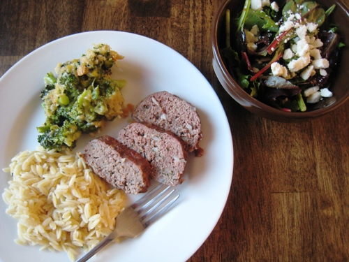 A plate of with Meatloaf and side dishes