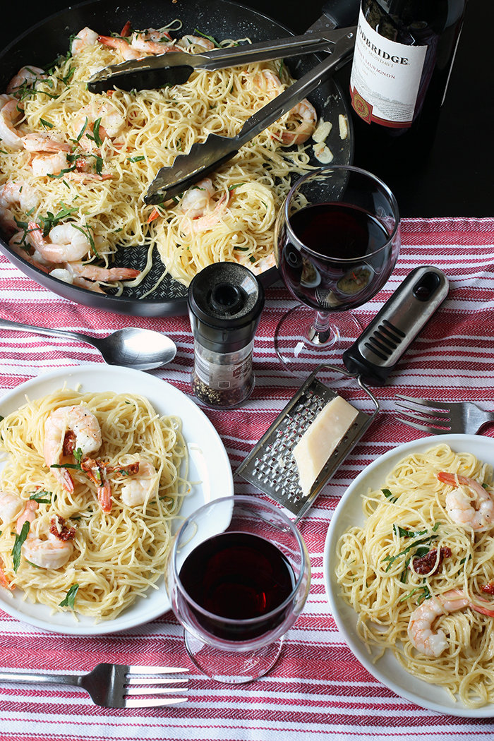 table set with shrimp pasta