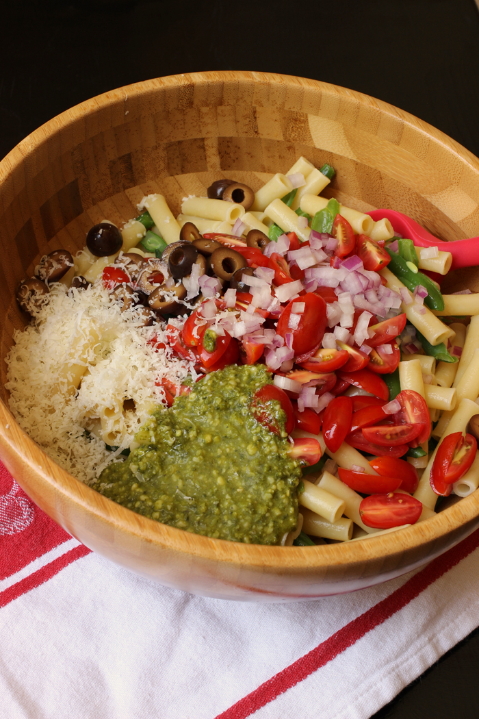 close up of ingredients for vegetable pesto pasta salad