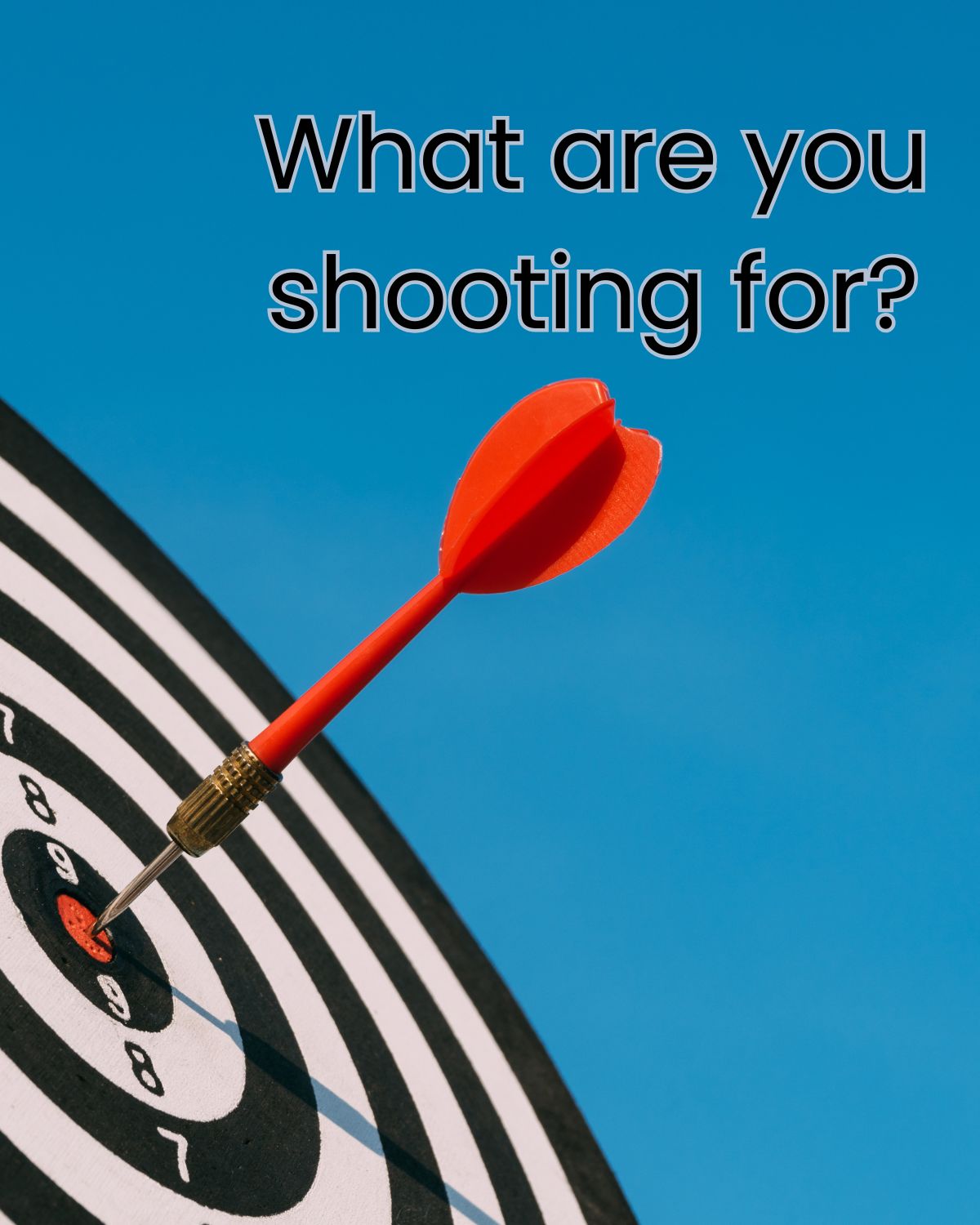 black and white target with a red arrow in bullseye, with text overlaid over a blue sky.