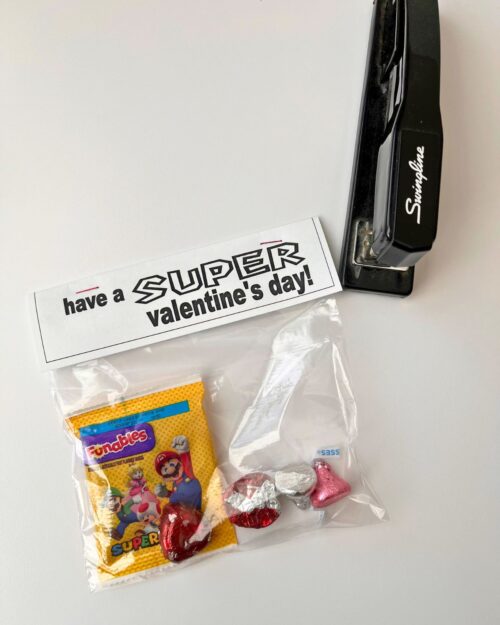 stapling the card to the treat bag.