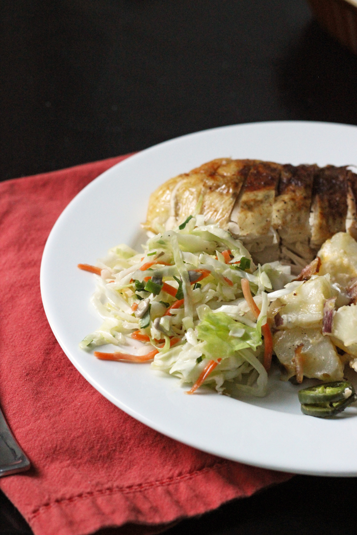 dinner plate with chicken, potatoes, and coleslaw