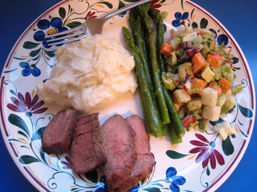 A plate with Tri-tip and vegetables