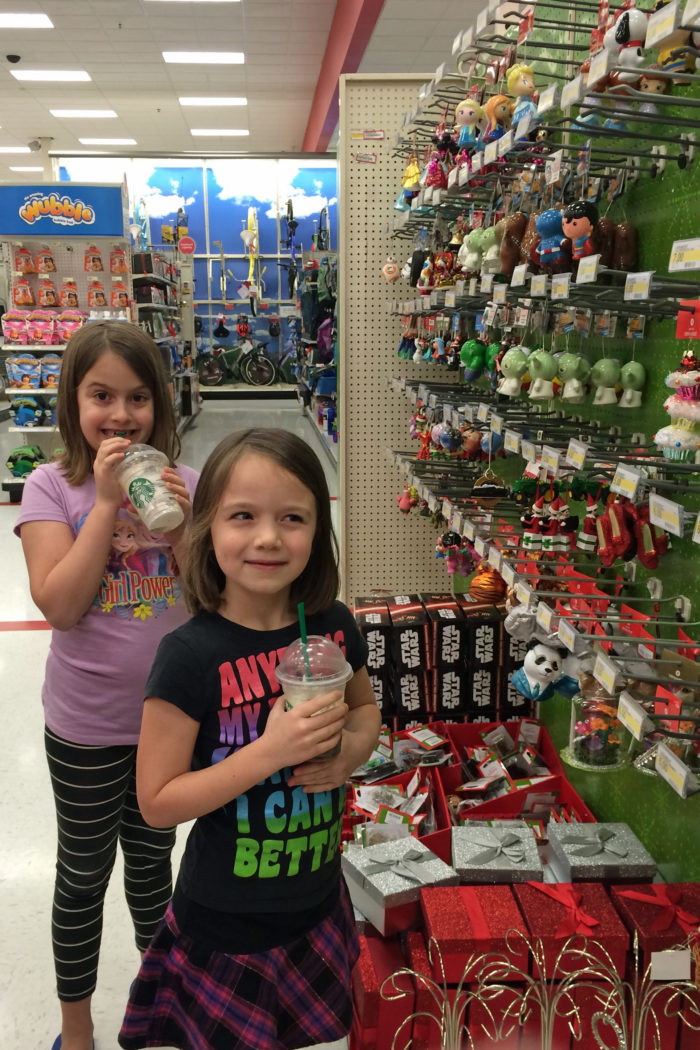 girls looking at christmas ornaments at target