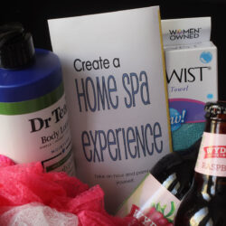 close-up shot of items in spa gift basket, focused on printable pamphlet.