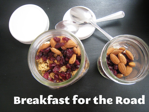 Breakfast items in jars on table with spoons, with text overlay.