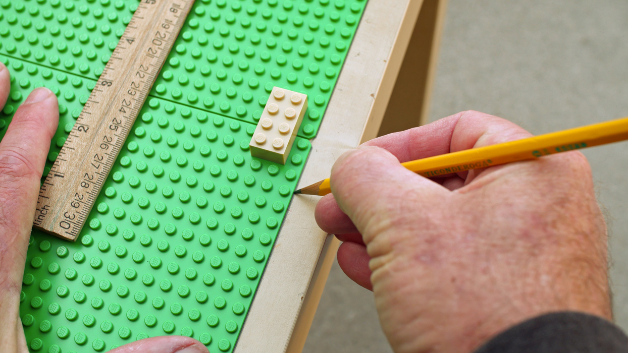 Making a lego table, marking with pencil.