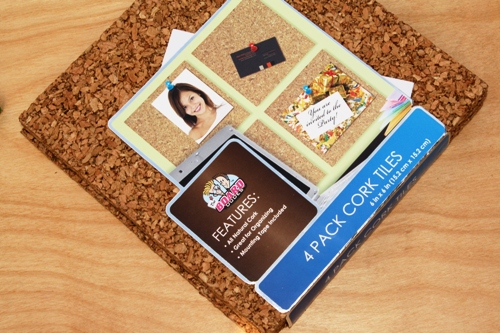 A pack of cork tiles on a table.