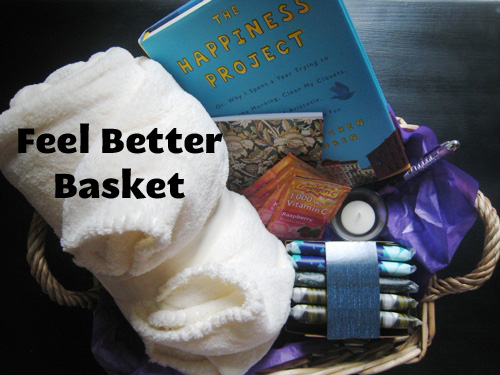 Basket with blanket, tissue, journal, pen, candle, book, and vitamin C on table, with text overlay.