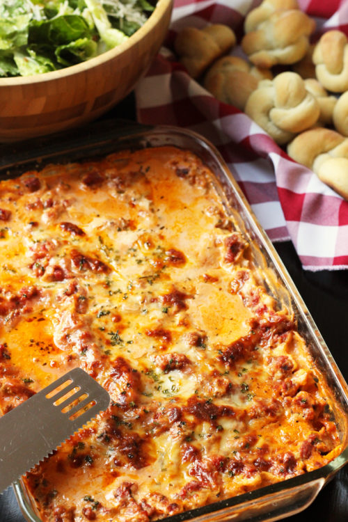 A close up of with Lasagne and Salad