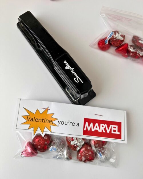 stapling the card to the treat bag.