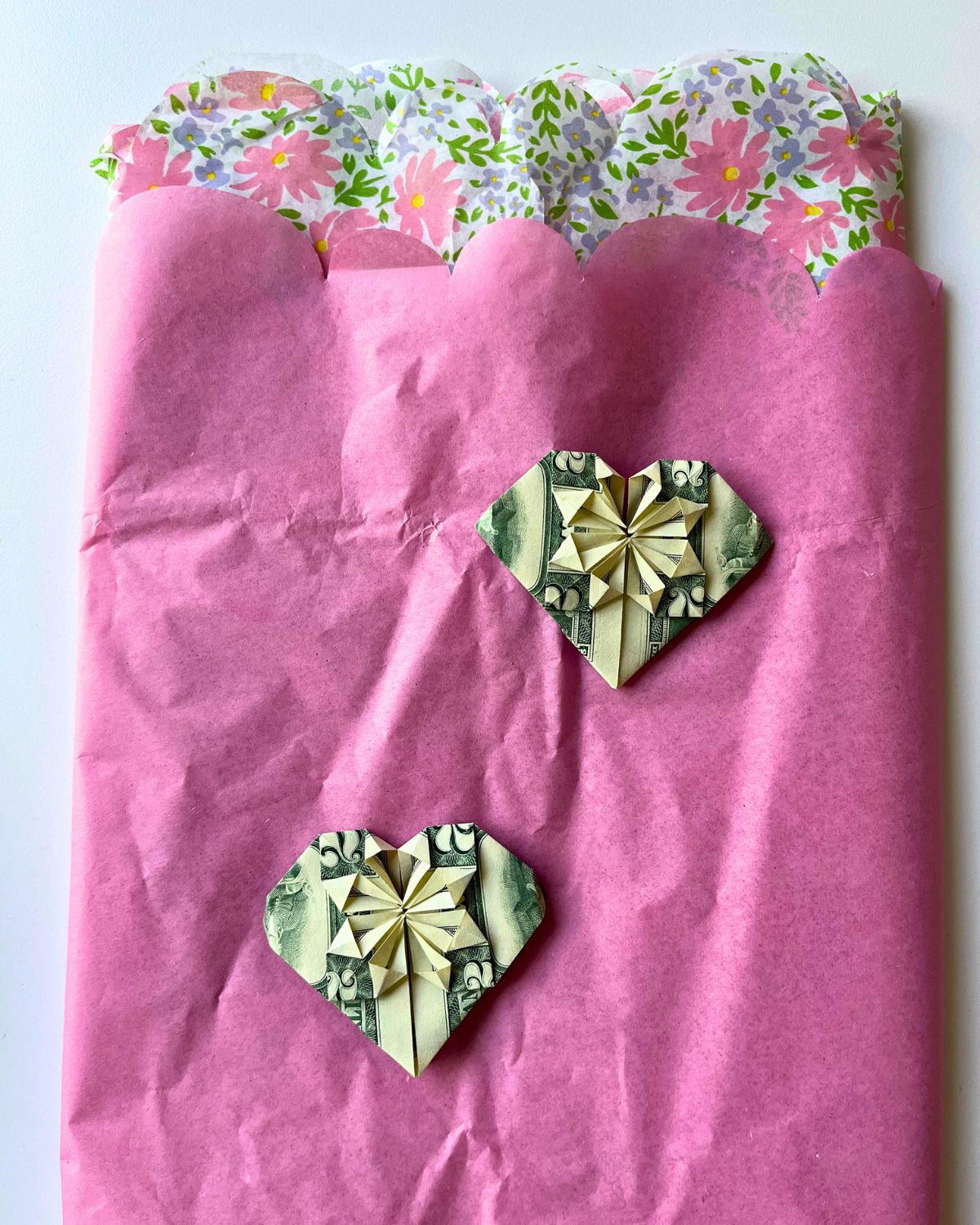 dollar bills folded into origami hearts.