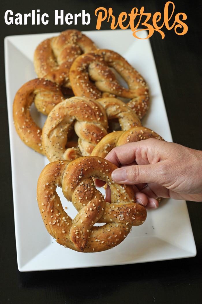 choosing a pretzel from the tray