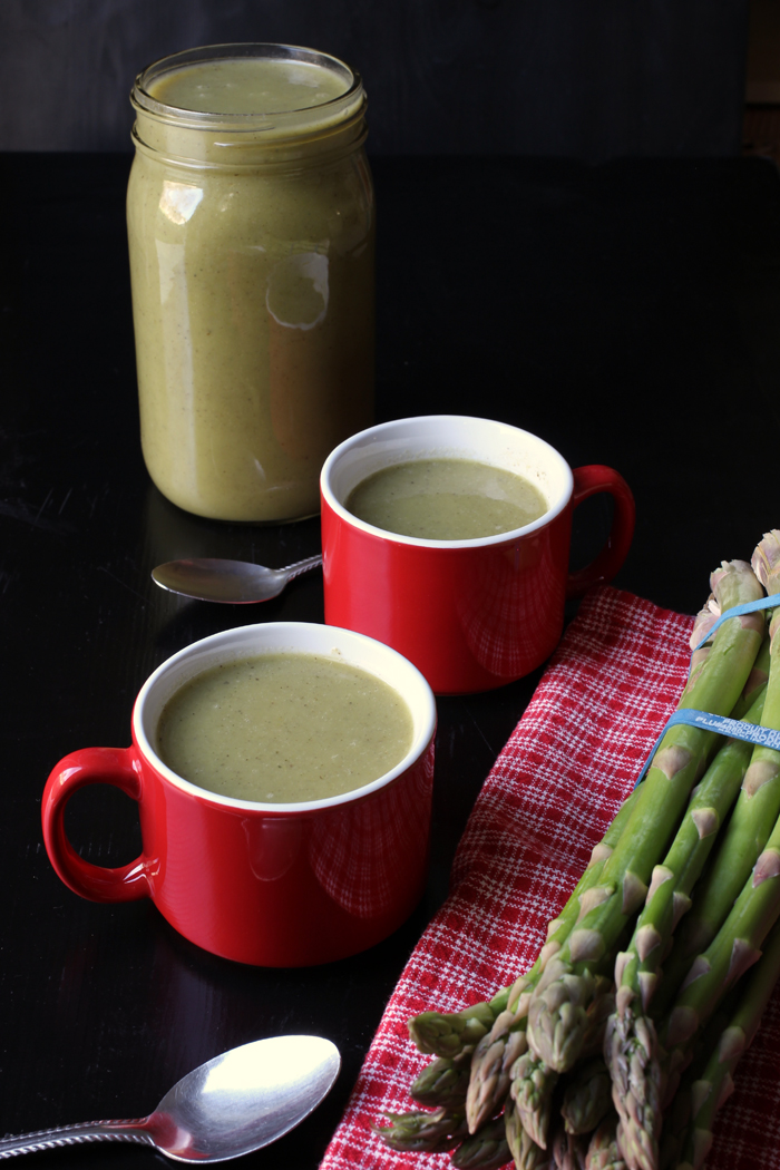 blended asparagus soup in cups and jar