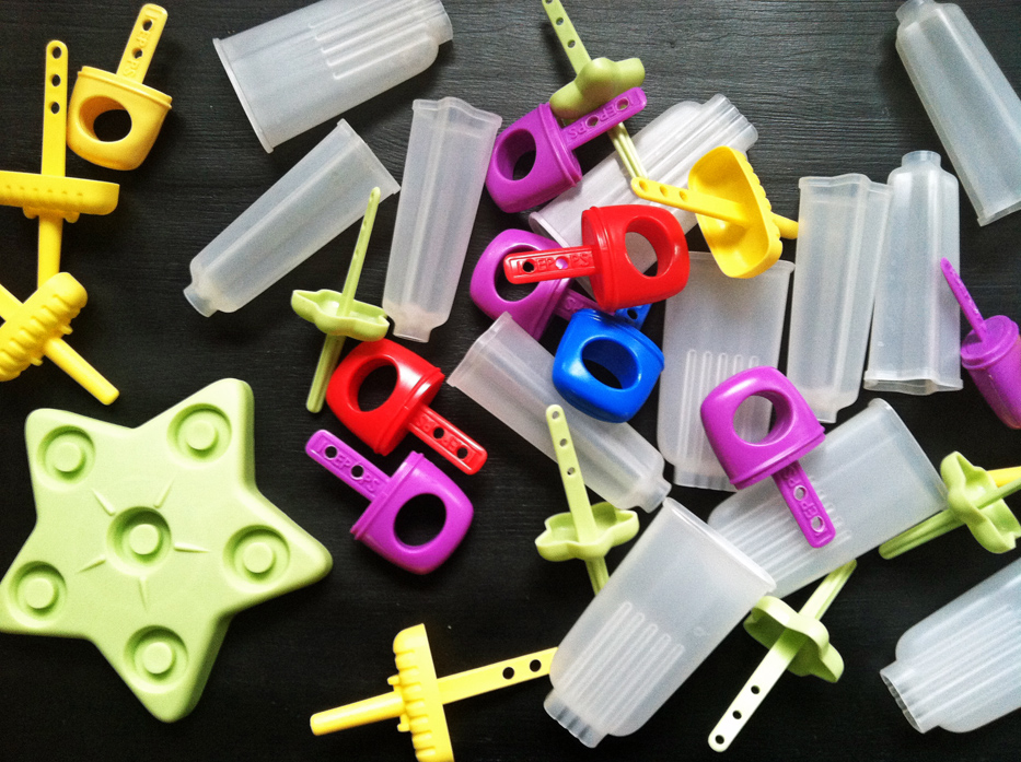 popsicle sticks and molds on table