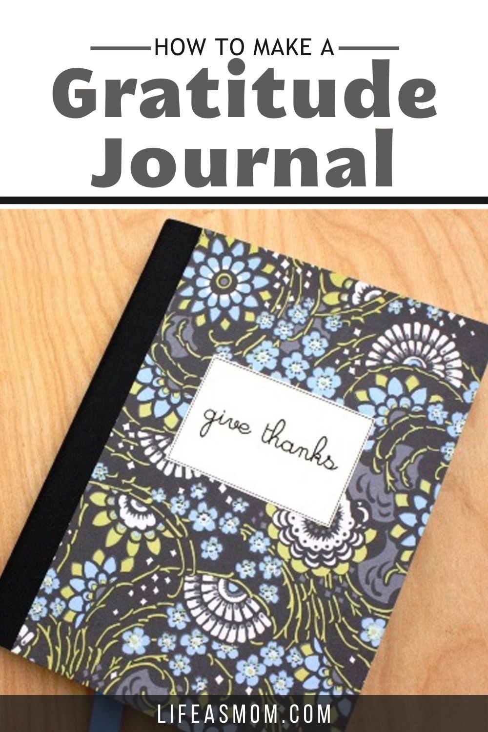 black and blue gratitude journal with give thanks label on maple table top with text overlay.
