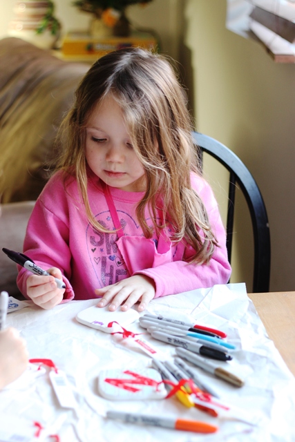 Ceramic Ornaments that Kids Can Decorate - Inexpensive ceramic ornaments become works of art when you hand the kids a set of Sharpies.