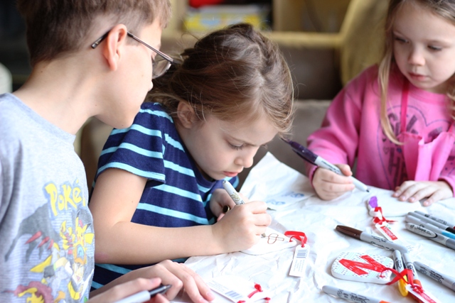 Ceramic Ornaments that Kids Can Decorate - Inexpensive ceramic ornaments become works of art when you hand the kids a set of Sharpies.