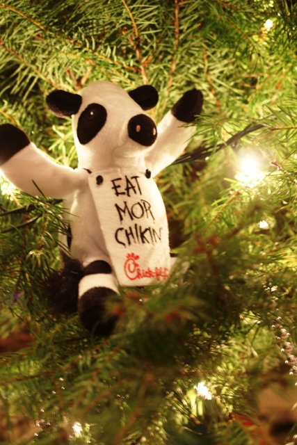 Eat More Chikin cow tow used as Christmas tree ornament.