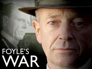 Michael Kitchen wearing a hat, with text overlay: Foyle's War.