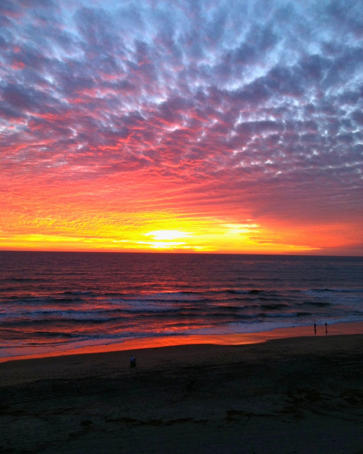 sunset over tamarack beach in carlsbad.