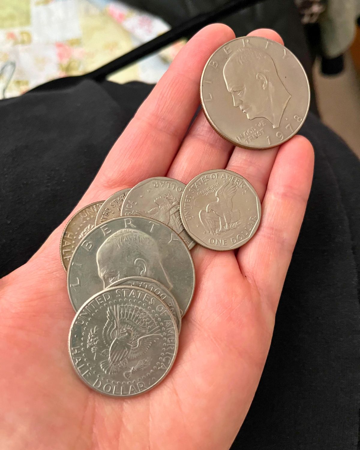 hand holding money coins.