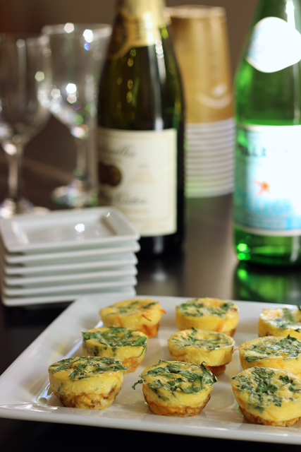 A plate of Frittata with glasses and bottles of drink