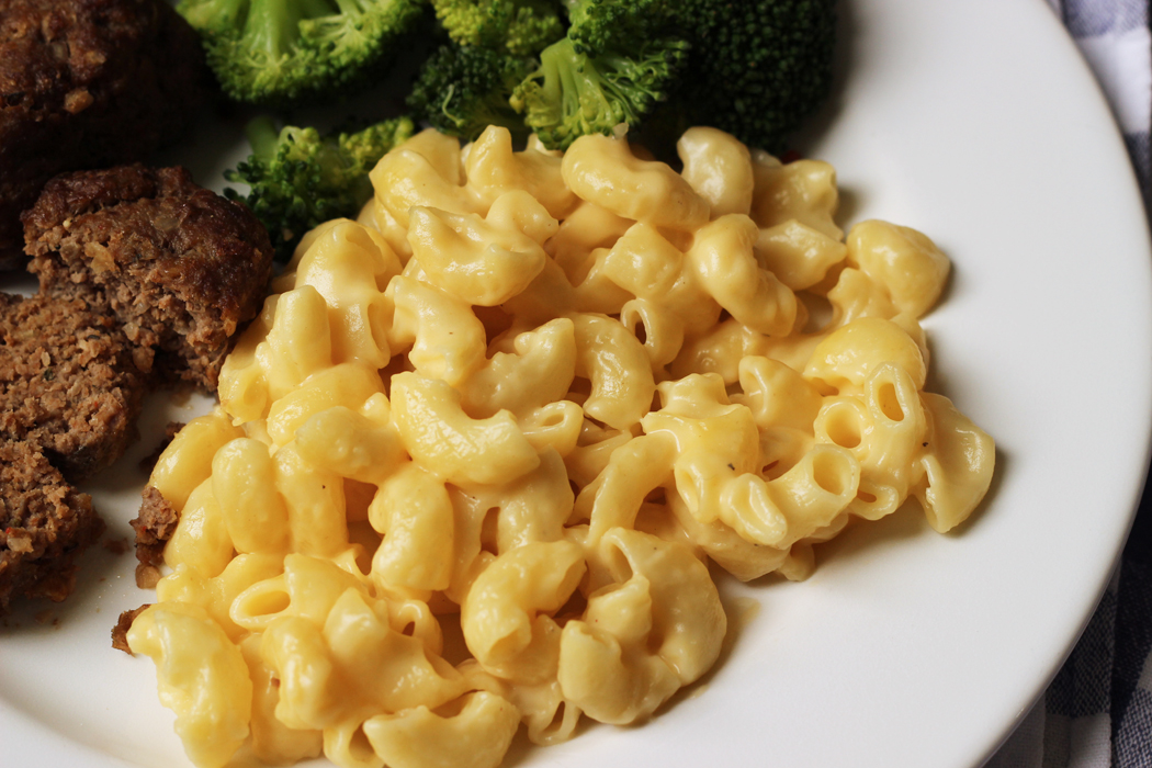 plate of mac and cheese with meatloaf and broccoli