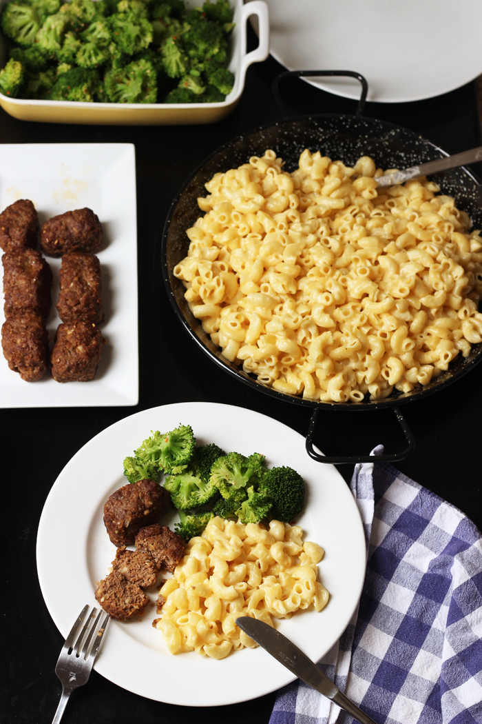 platters of meatloaves and macaroni next to dinner plate