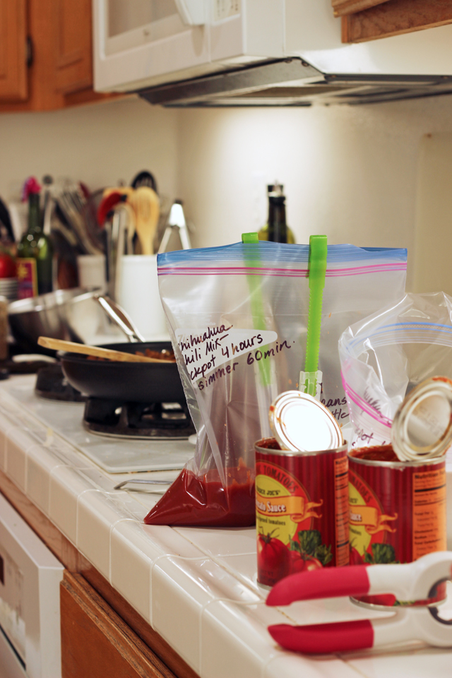 bag holder and tomato cans on counter